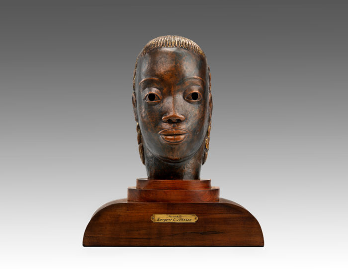 <p>Sargent Johnson, <em>Mask</em>, ca. 1930–1935, copper on wood base. Smithsonian American Art Museum, gift of International Business Machines Corporation.</p>
