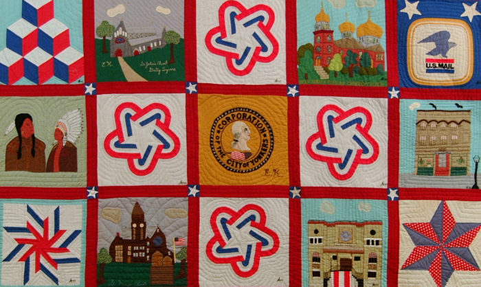 <p>Ellanora Kolb (American, 1904–2000), Anna McDonough (American, 1910–2000), and Pauline Ringler (American,1909–2006). <em>Bicentennial Quilt</em> (detail), 1976. Cloth. 96 1/2 x 78 1/2 inches. Gift of The Woman’s Institute of Yonkers, 2005 (2005.02.03).</p>
