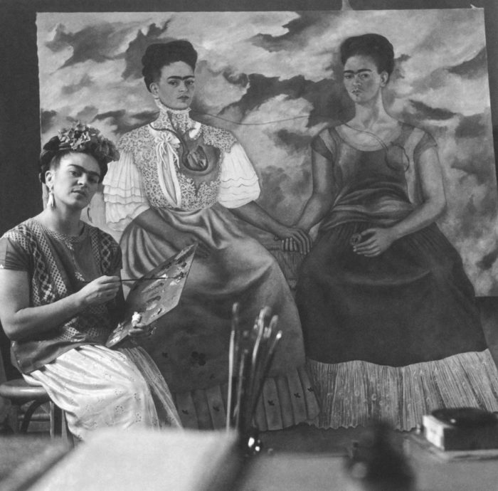 <p>Photo by Nickolas Muray (American, b. Hungary, 1892–1965). <em>Frida Kahlo Painting ‘The Two Fridas’</em>, 1939. Platinum print. Courtesy of Throckmorton Fine Arts, New York. © Nickolas Muray Photo Archives.</p>
