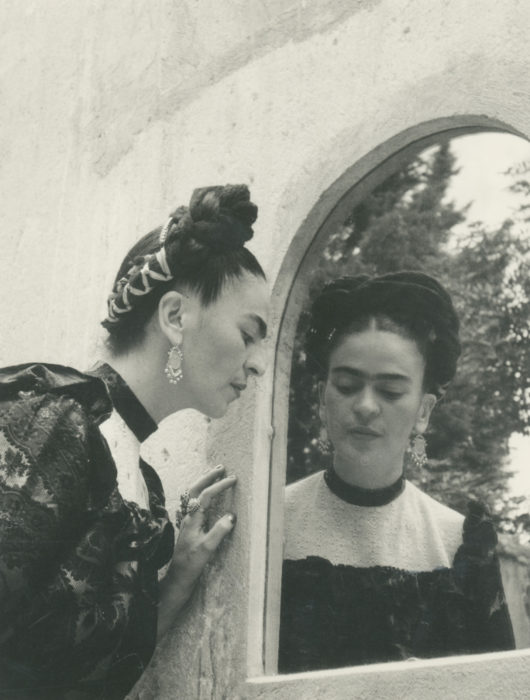 <p>Lola Álvarez Bravo (Mexican, 1903–1993). <em>Frida Looking Into Mirror</em>, 1944. Gelatin silver print mounted on board. Courtesy of Throckmorton Fine Art, New York.</p>
